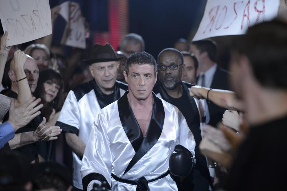 This image released by Warner Bros. Pictures shows Sylvester Stallone as Henry "Razor" Sharp, center, and Alan Arkin as Louis "Lightning" Conlon, center left, in a scene from "Grudge Match." (AP Photo/Warner Bros. Pictures, Ben Rothstein)