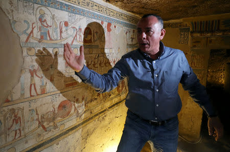 Secretary-General of the Supreme Council of Antiquities, Mostafa Waziri, explaining paintings on the walls of the newly discovered burial site, Tomb of Tutu, at al-Dayabat, Sohag, Egypt April 5, 2019. REUTERS/Mohamed Abd El Ghany