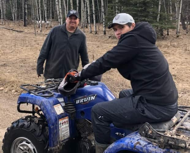 Blade Crow, right, pictured with his father Morris Crowspreadswings. Crow was killed after an SUV hit him and hit family as they waited to cross the street near Chinook mall in Calgary on Thursday.