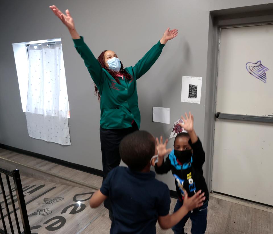 Yolanda Williams, owner of Dee's Little Angels Child Care Center in Detroit dances with kids before their lunch on Thursday, April 20, 2023. Child care providers have been frustrated by the delay in DHHS notifications when children who receive subsidies through the state's child care subsidy program get their hours reduced or canceled. 