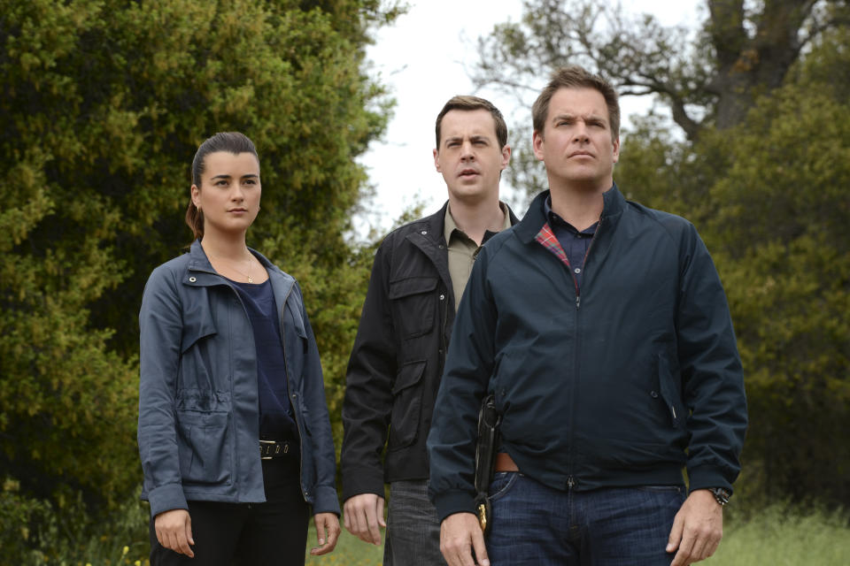 This publicity image released by CBS shows, cast members, from left, Cote de Pablo, Sean Murray and Michael Weatherly in a scene from "NCIS." De Pablo will not be returning to the series. CBS Corp. chief executive Les Moonves said Monday, July 29, 2013, that every effort was made to keep actress Cote de Pablo on TV's highest-rated show, "NCIS." (AP Photo/CBS, Michael Yarish)