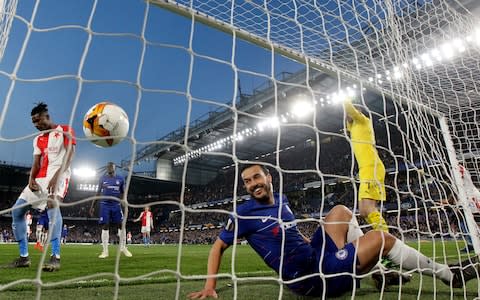 Chelsea's Pedro celebrates with team mates after Slavia Prague's Simon Deli scored an own goal and Chelsea's second - Credit: Reuters