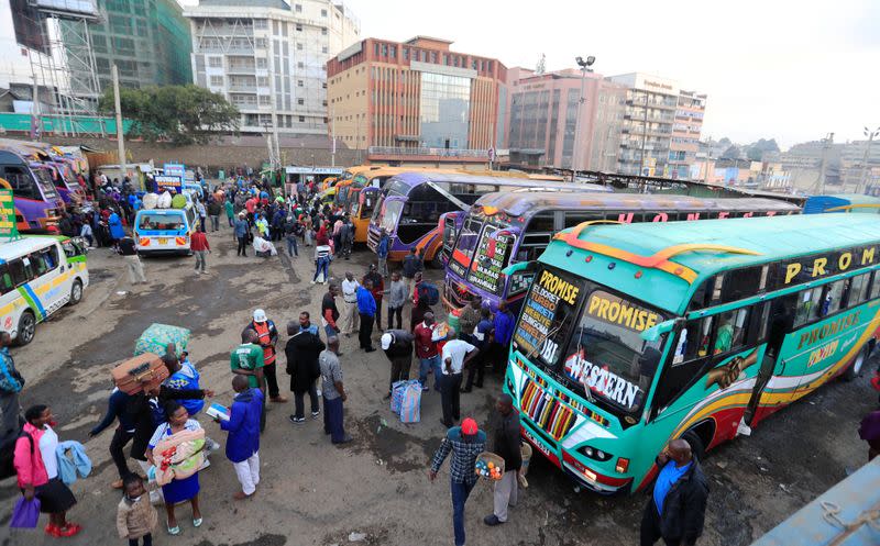 Passengers board a disinfected public transport buses as residents leave for the villages amid concerns over the spread of coronavirus disease (COVID-19) in Nairobi