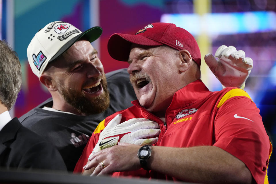 Kansas City Chiefs head coach Andy Reid, right, and Travis Kelce (87) celebrate their win after the NFL Super Bowl 57 football game, Sunday, Feb. 12, 2023, in Glendale, Ariz. The Chiefs defeated the Philadelphia Eagles 38-35. (AP Photo/Matt Slocum)