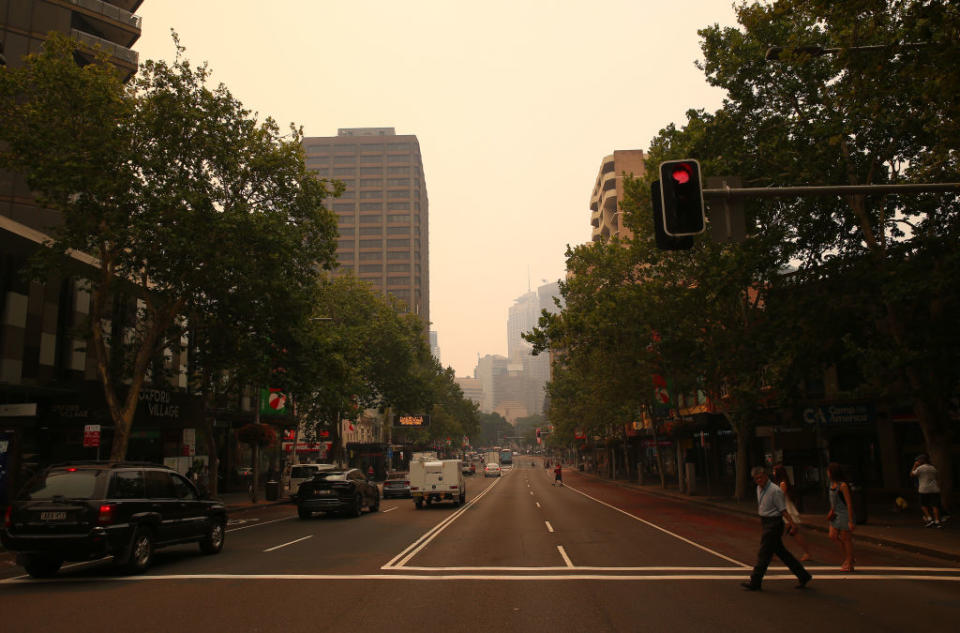 Face masks are flying off shelves in Sydney as smoke blankets parts of the state. Source: Getty