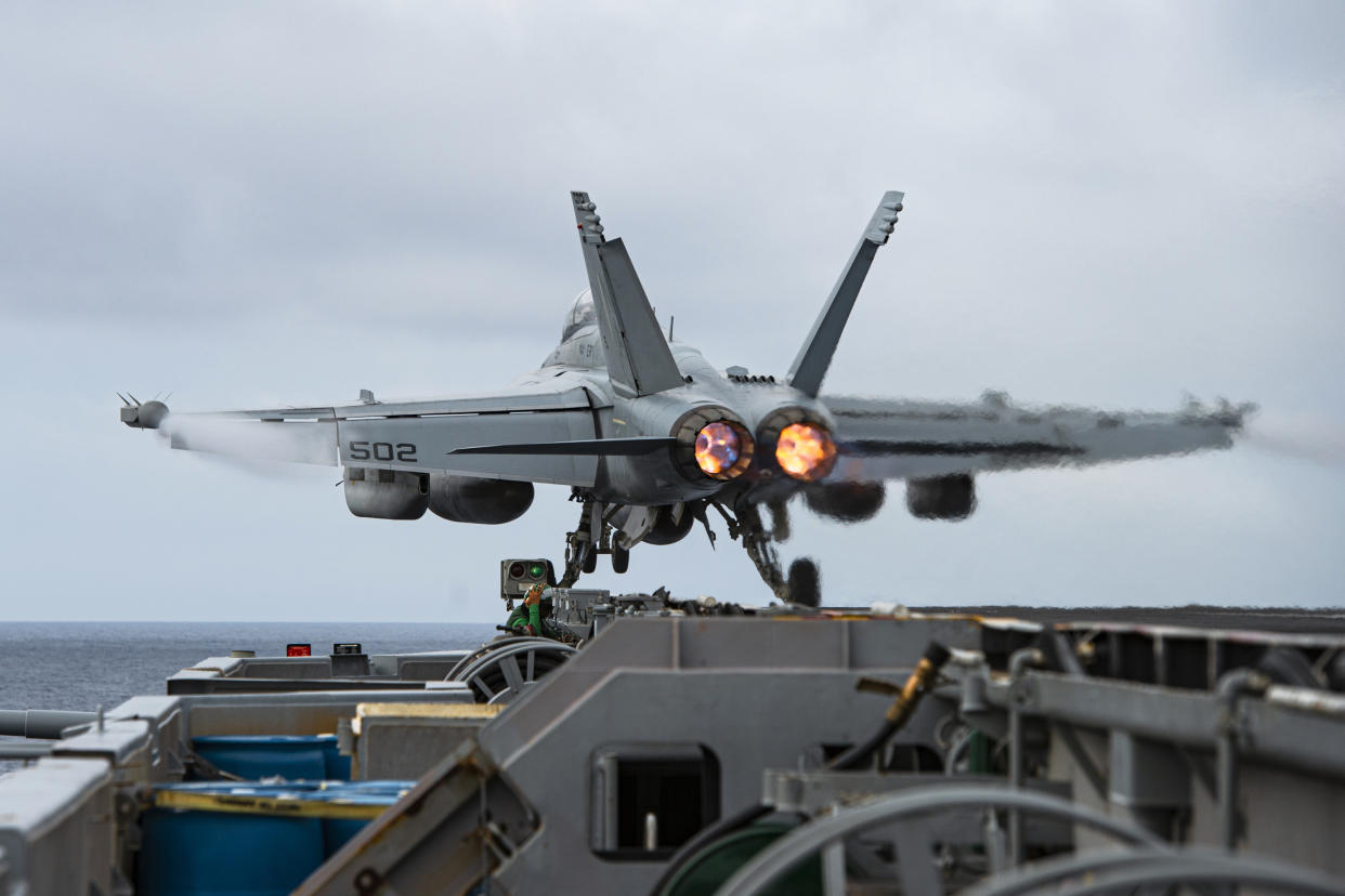 An E/A-18G Growler aircraft launches from the flight deck of the aircraft carrier USS Nimitz in the South China Sea. (Mass Communication Specialist 3rd Class Joseph Calabrese/U.S. Navy via AP)