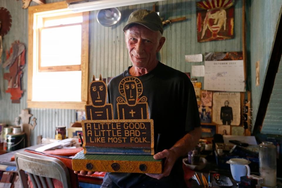 Folk artist Chris Hubbard poses for a photo in his workshop at his home in Farmington, Ga., on Wednesday, Oct. 5, 2022.