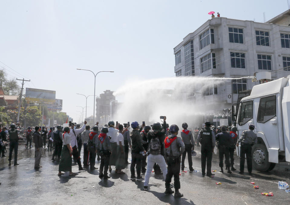 Police use water cannon to disperse demonstrators during a protest in Mandalay, Myanmar, Tuesday, Feb. 9, 2021. Police were cracking down on the demonstrators against Myanmar’s military takeover who took to the streets in defiance of new protest bans. (AP Photo)