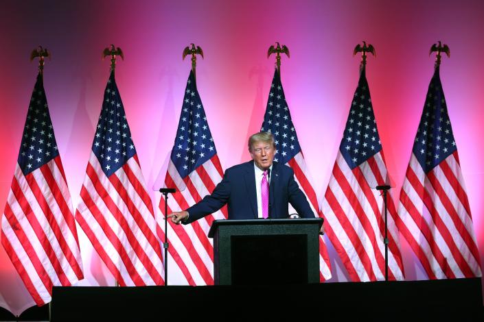 Former President Donald Trump speaks June 25 to guests at the Republican Party's Lincoln Day dinner in Oakland County, Michigan.  Oregon officials announced that Trump had won an election for the Hubbard Rural Fire Protection District in a write-in candidate tiebreaker.