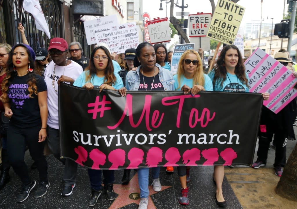 In this Nov. 1, 2017, file photo, Tarana Burke, founder and leader of the #MeToo movement, marches with others at the #MeToo March in the Hollywood section of Los Angeles. (AP Photo/Damian Dovarganes, File)