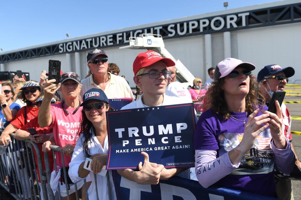 Supporters of US President Donald Trump wait for him to speak during a Campaign Coalitions Event with Florida Sheriffs at Tampa International Airport in Tampa, Florida, July 31, 2020. (Saul Loeb/AFP via Getty Images)