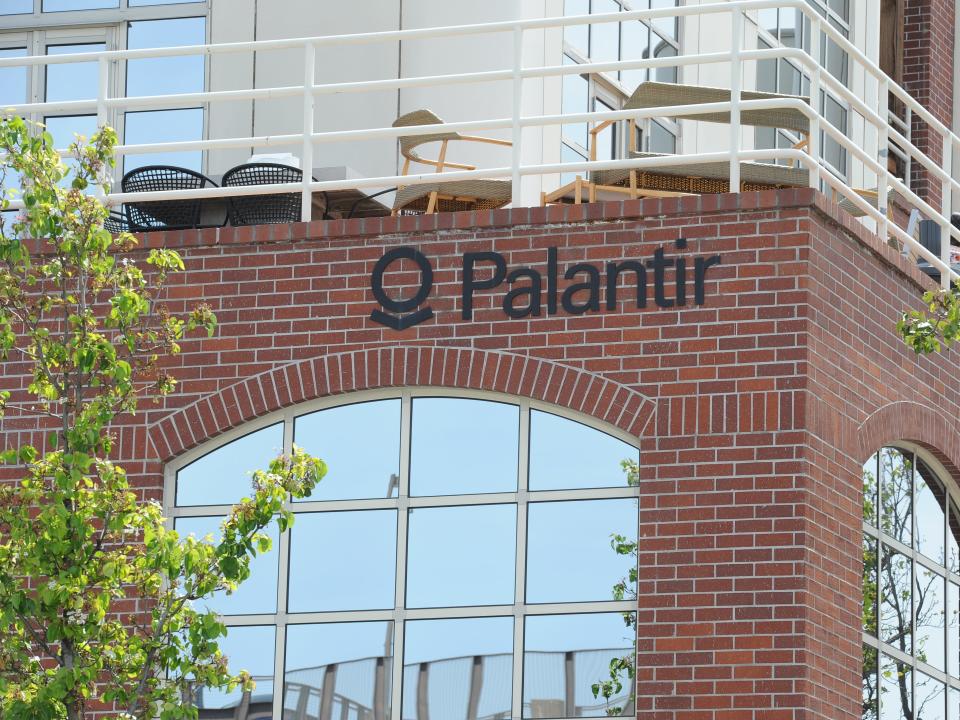 The logo of the data analysis company Palantir can be seen at the company's headquarters in 2018.