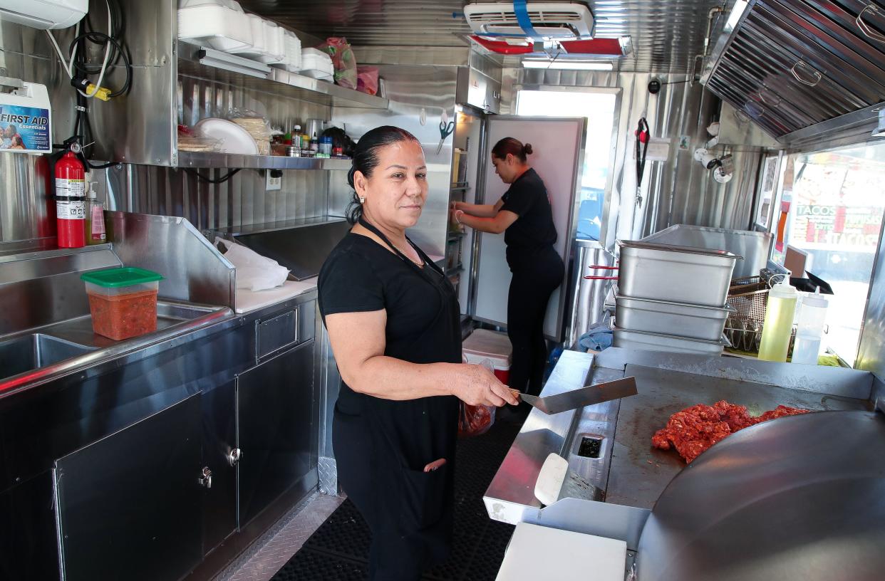 Micaela Montez, left, and her daughter Pilar Paniagua work inside their food truck business, El Berrinche Tacos and Mariscos, last week in Desert Hot Springs.