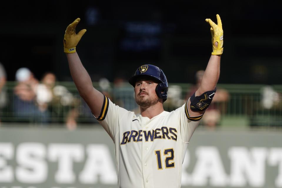 Milwaukee Brewers' Hunter Renfroe reacts after hitting an RBI double during the fourth inning of game 1 of a doubleheader baseball game against the San Francisco Giants Thursday, Sept. 8, 2022, in Milwaukee. (AP Photo/Morry Gash)