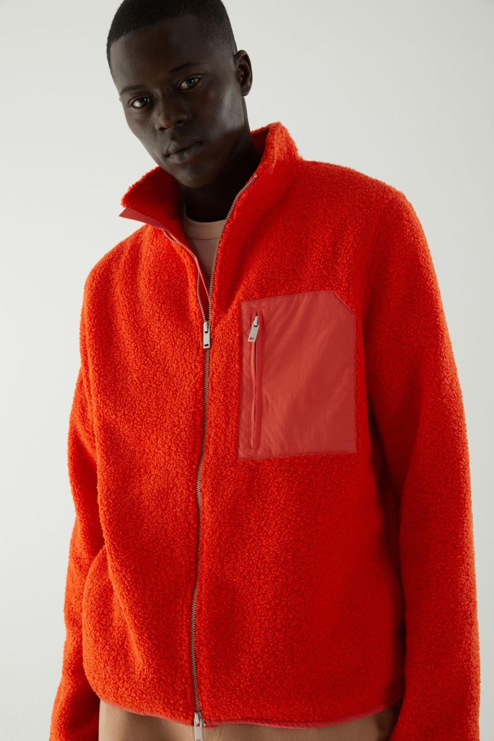 Photo of a model wearing a COS jacket.