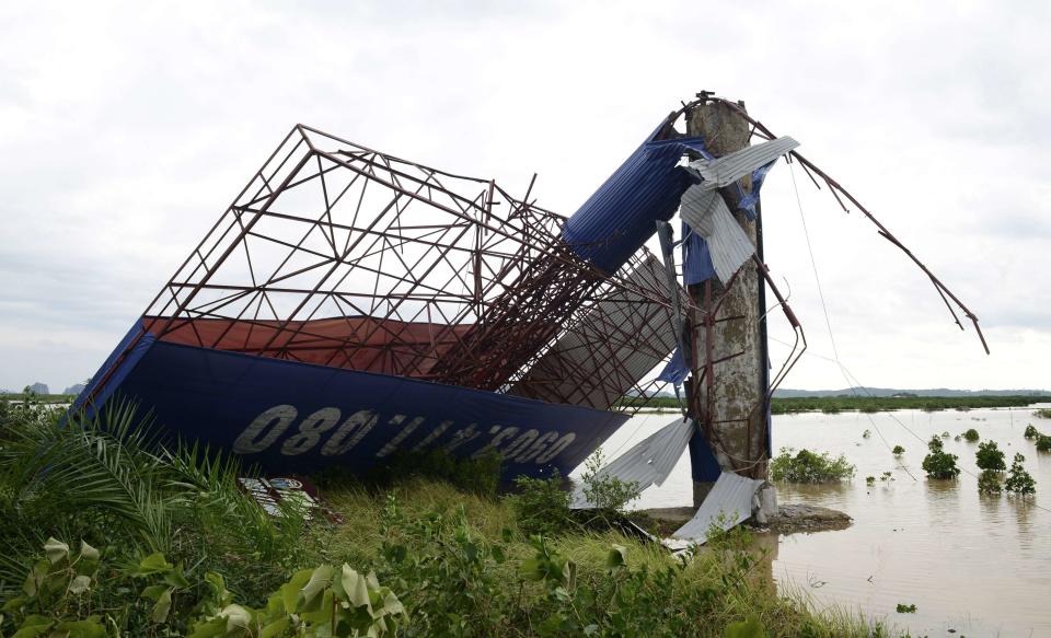 A fallen billboard is seen at Ha Long Bay in the aftermath of typhoon Haiyan in Quang Ninh province