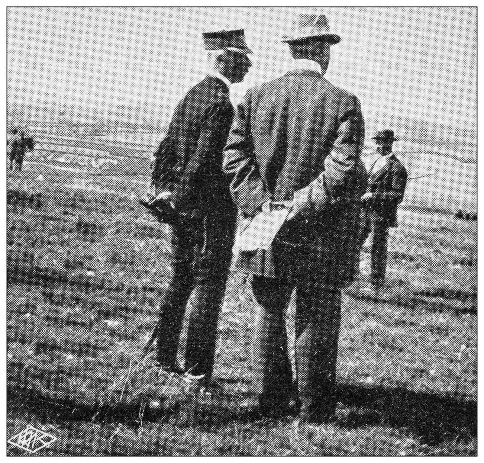 Men standing with their hands behind their backs