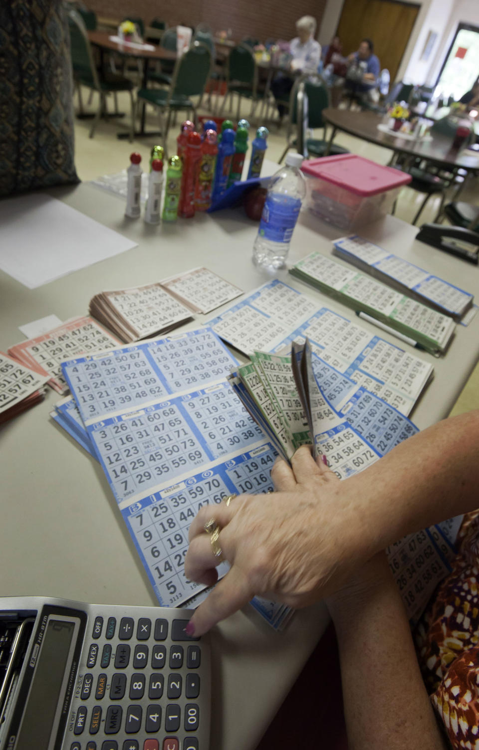 In this photo taken Tuesday, April 10, 2012, Bingo cards are purchased in Bald Knob, Ark. (AP Photo/Danny Johnston)