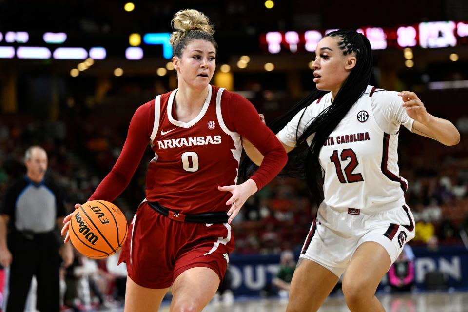 GREENVILLE, SOUTH CAROLINA - MARCH 03: Saylor Poffenbarger #0 of the Arkansas Razorbacks dribbles against Brea Beal #12 of the South Carolina Gamecocks in the second quarter during the quarterfinals of the SEC Women's Basketball Tournament at Bon Secours Wellness Arena on March 03, 2023 in Greenville, South Carolina. (Photo by Eakin Howard/Getty Images)