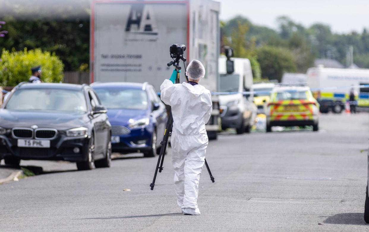 A forensic investigator in Hart Street, Southport