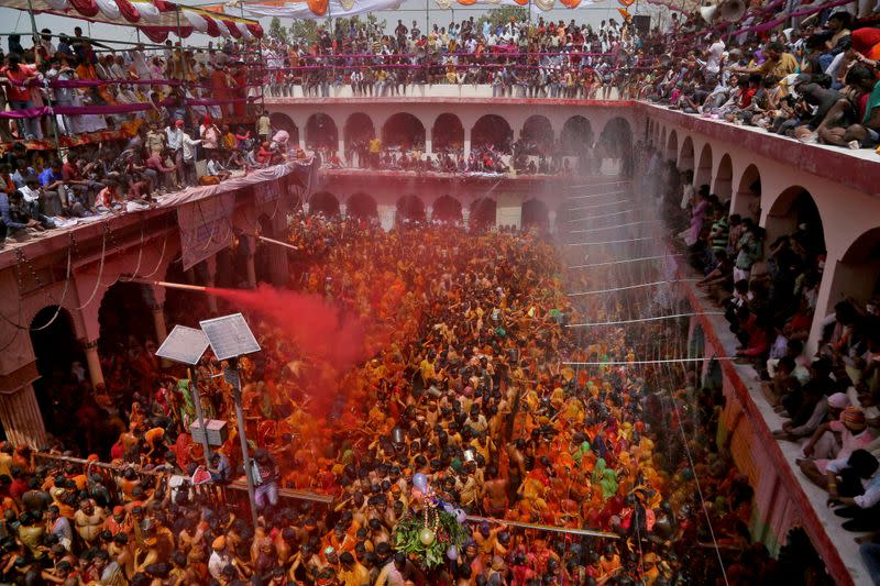 FILE PHOTO: Hindu devotees take part in 'Huranga', at Dauji temple near Mathura