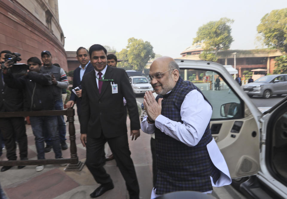 Indian Home minister and Bharatiya Janata Party (BJP) leader Amit Shah arrives at the Parliament House in New Delhi, India, Thursday, Dec. 5, 2019. A former Indian finance minister just released on bail in a bribery case has joined a protest of the government's economic policies, which are being blamed for India's slowest economic growth in six years. (AP Photo/Manish Swarup)