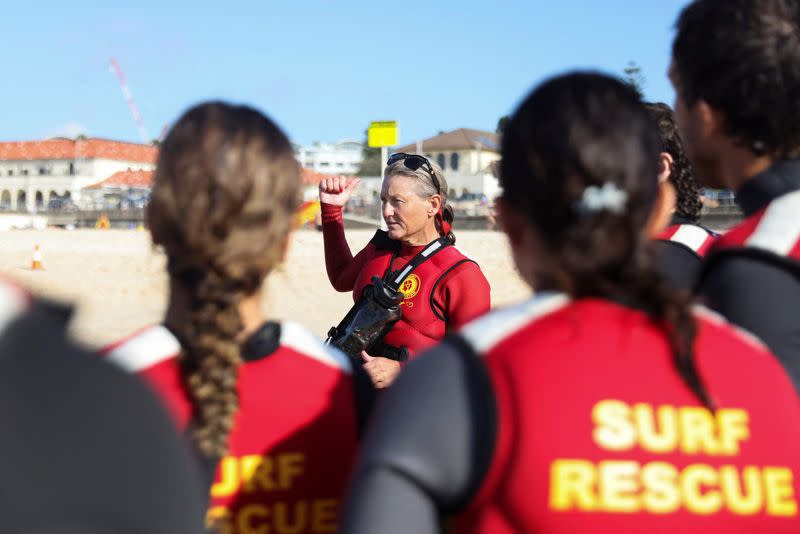 IRB Racing team captain Nixy Krite talks to lifesavers on Bondi Beach