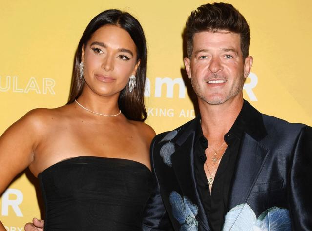 Robin Thicke posts pic of wife's near nip slip days after