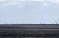 The alleged on-going land reclamation of China at Subi reef is seen from Pagasa island (Thitu Island) in the Spratlys group of islands in the South China Sea, west of Palawan, Philippines, in this May 11, 2015 file photo. REUTERS/Ritchie B. Tongo/Pool/Files