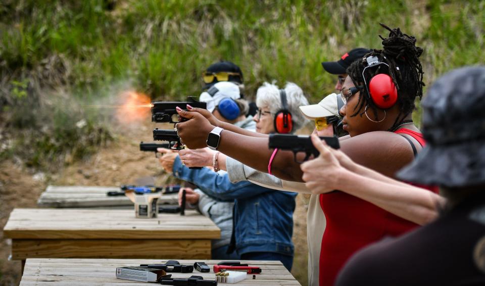 Tabitha Boyles, 31, right, works on handgun shooting skills, Thursday, June 6, 2024, during 'Ladies Night at the Range" at the Capital Area Sportsmens League (CASL) pistol range in Delta Township. New and seasoned women shooters gather twice a month at the club to learn firearms safety and practice handgun shooting skills.