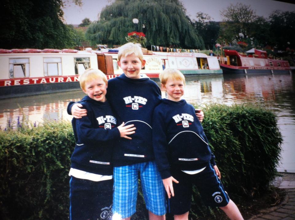 Adam Bradford and his brothers Alex and Ryan in happier times before the bombshell phone call from David's solicitor with life-changing news. (Supplied)