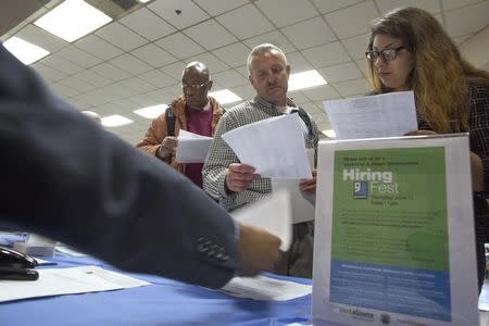 People seek employment at a job fair for the homeless at the Los Angeles Mission in the Skid Row area of Los Angeles, California June 4, 2015. REUTERS/David McNew