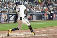 Milwaukee Brewers' Brice Turang hits a triple during the fourth inning of a baseball game against the Baltimore Orioles Tuesday, June 6, 2023, in Milwaukee. (AP Photo/Morry Gash)