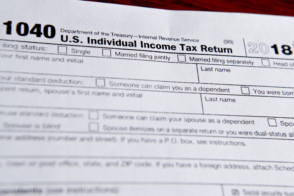 This photo made on Wednesday, Feb. 13, 2019, in Zelienople, Pa., shows 1040 tax forms printed from the Internal Revenue Service web page that are used for 2018 U.S. federal tax returns. (AP Photo/Keith Srakocic)