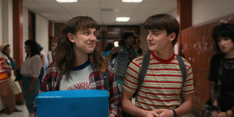 (L to R) Millie Bobby Brown and Noah Schnapp rock the “Byers bang cut.” - Credit: Courtesy of Netflix