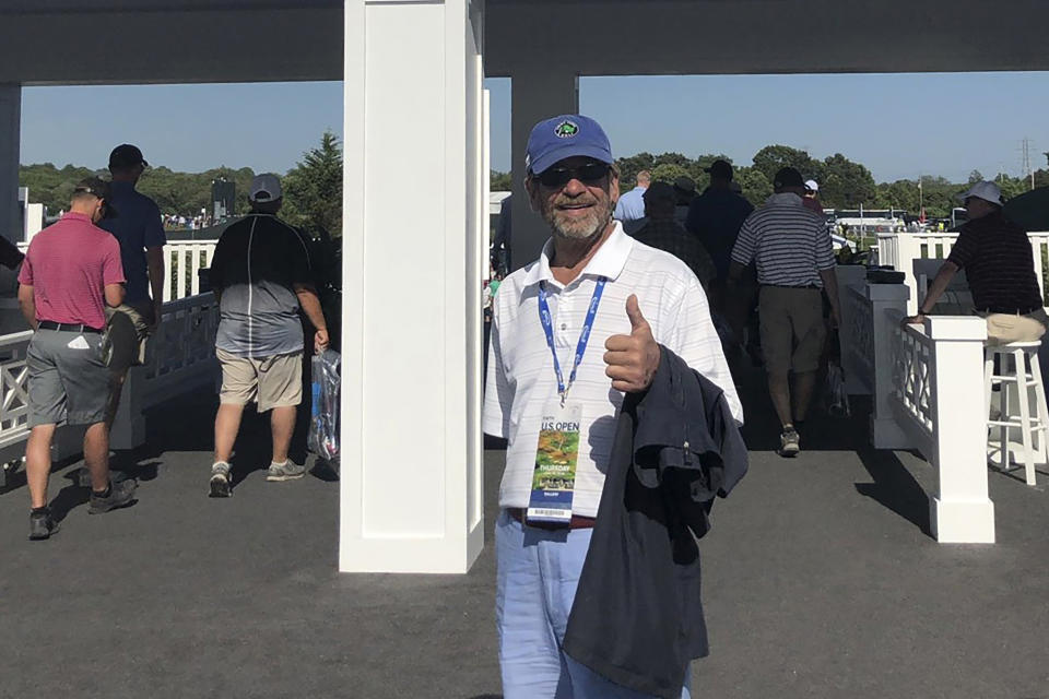 Ted Conrad stands for a photograph at an entrance to the 2018 U.S. Open Golf Tournament at Shinnecock Hills Golf Club. Source: Bob Van Wert via AP