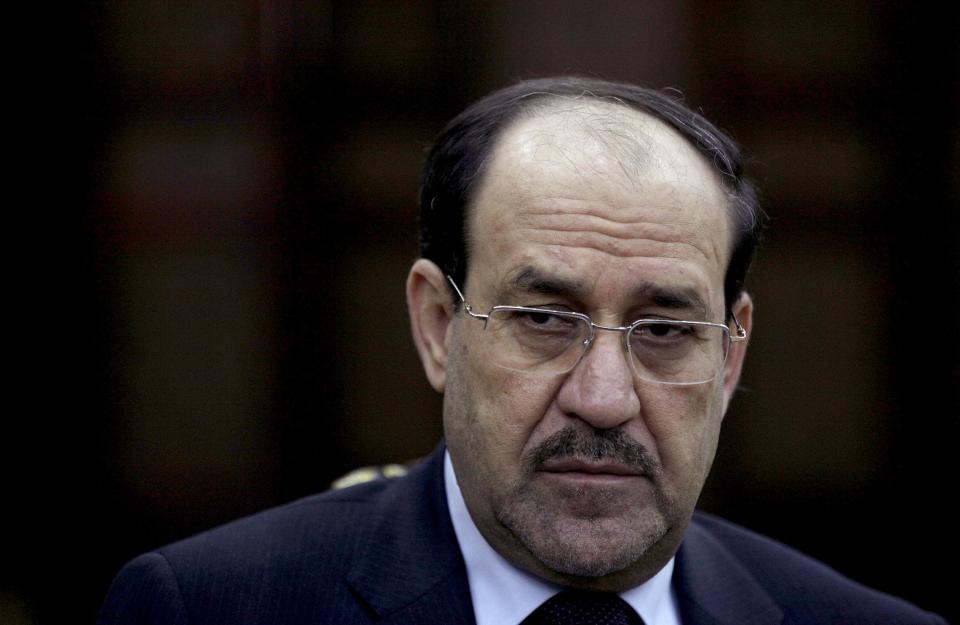 FILE - In this, Feb. 27, 2013, file photo Iraq's Prime Minister Nouri al-Maliki listens to a question during an interview with The Associated Press in Baghdad, Iraq. If Iraqi Prime Minister Nouri al-Maliki wins a third four-year term in parliamentary elections Wednesday, he is likely to rely on a narrow sectarian Shiite base, only fueling divisions as Iraq slides deeper into bloody Shiite-Sunni hatreds. (AP Photo/Khalid Mohammed, File)