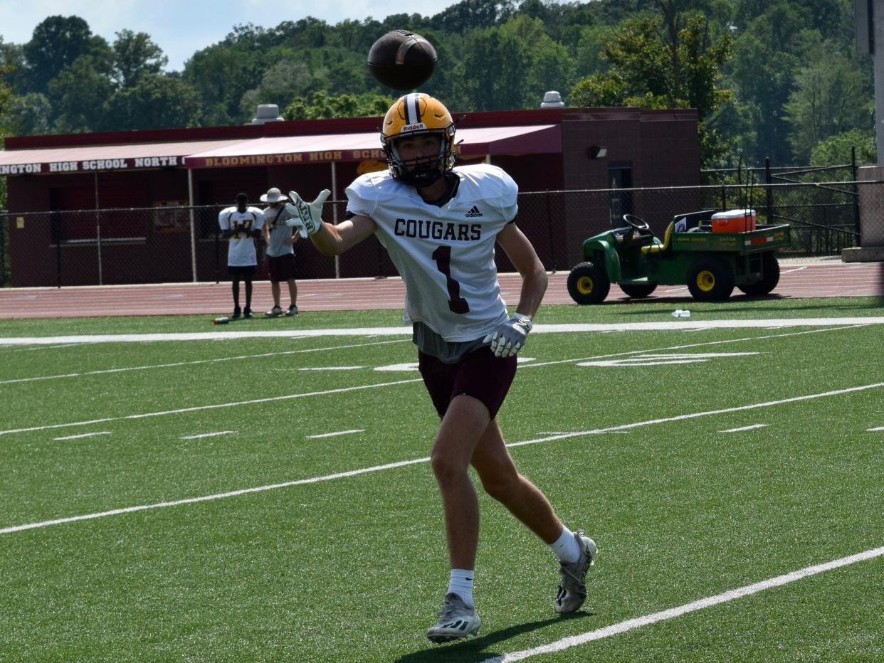 Bloomington North junior wide receiver Tate Bless reaches for a ball during practice on Wednesday, August 3, 2022. (Seth Tow/Herald-Times)