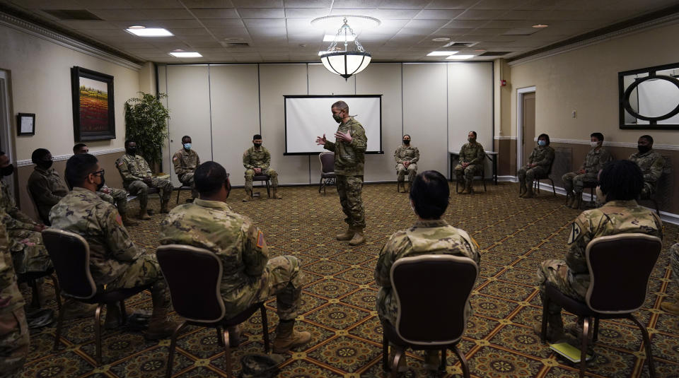 Sergeant Major of the Army Michael Grinston, center, gets feedback from soldiers about their concerns at Fort Hood, Texas, Thursday, Jan. 7, 2021. Following more than two dozen soldier deaths in 2020, including multiple homicides, the U.S. Army Base is facing an issue of distrust among soldiers. (AP Photo/Eric Gay)