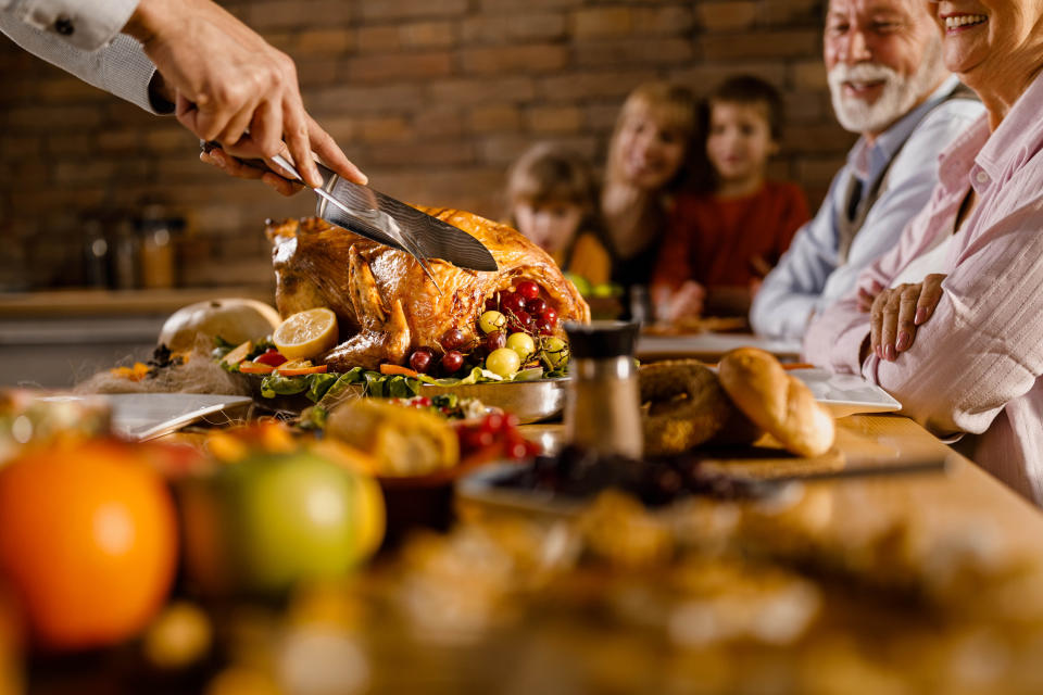 A person serving a large Thanksgiving meal