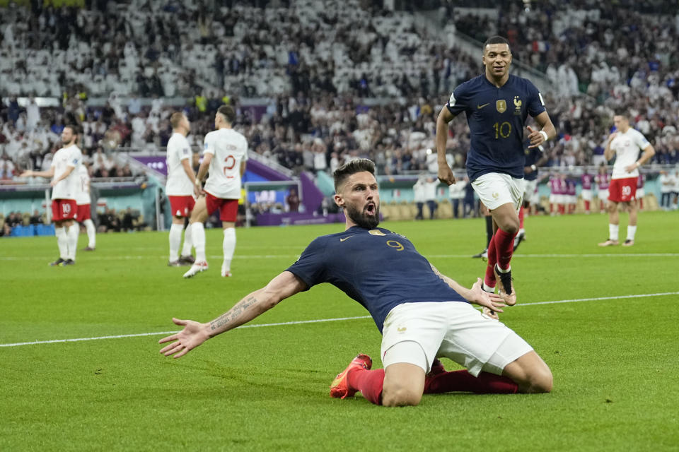 France's Olivier Giroud celebrates after scoring the opening goal during the World Cup round of 16 soccer match between France and Poland, at the Al Thumama Stadium in Doha, Qatar, Sunday, Dec. 4, 2022. (AP Photo/Ebrahim Noroozi)