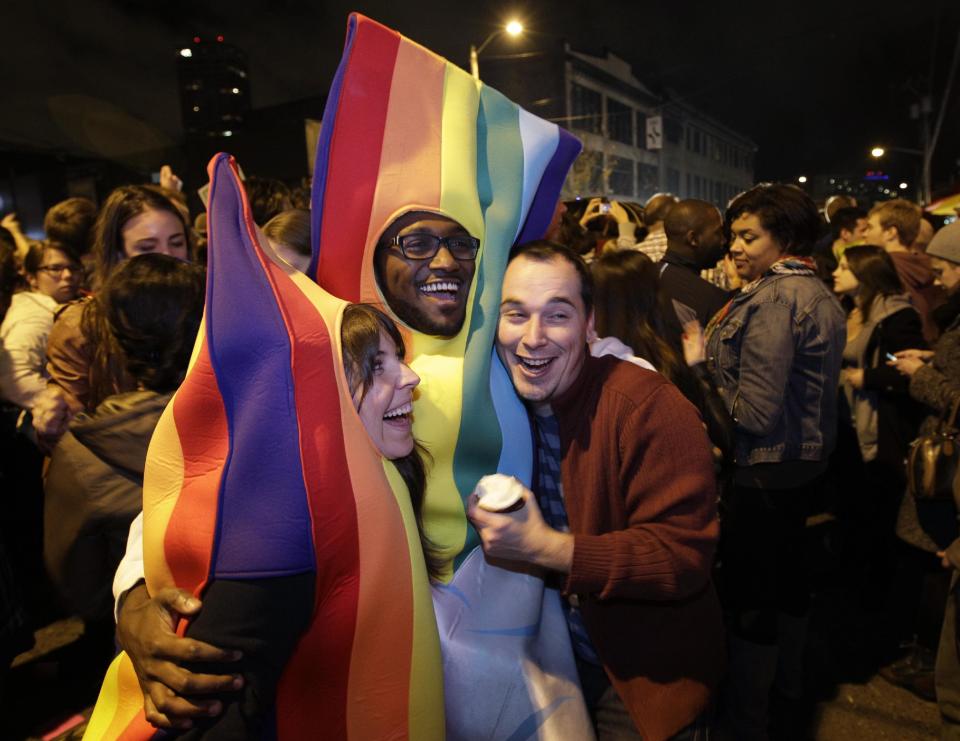 People celebrate early election returns favoring Washington state Referendum 74, which would legalize gay marriage, during a large impromptu street gathering in Seattle's Capitol Hill neighborhood, Tuesday, Nov. 6, 2012. The re-election of President Barack Obama and Referendum 74 drew the most supporters to the streets. (AP Photo/Ted S. Warren)