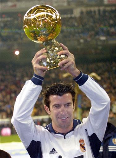 Real de Madrid Portuguese Luis Figo holds the gold ball before a League match between Real Madrid and Oviedo in Barnabeu stadium in Madrid 14 january 2001