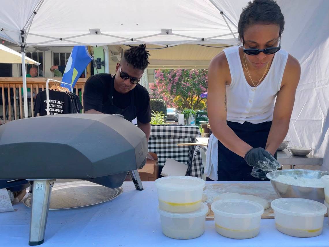 Kerrel and Nkem Thompson make pizzas at a July 2021 pop-up at Crafty Beer Guys in Huntersville.