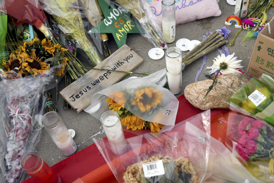 A religious plaque at a memorial outside Club Q in Colorado Springs, Colo., on Wednesday, Nov. 23, 2022. Five people were killed when a gunman opened fire at the club Saturday night. (AP Photo/Thomas Peipert)