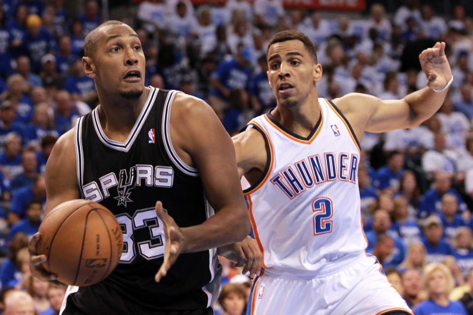 OKLAHOMA CITY, OK - JUNE 02: Boris Diaw #33 of the San Antonio Spurs drives on Thabo Sefolosha #2 of the Oklahoma City Thunder in the first quarter in Game Four of the Western Conference Finals of the 2012 NBA Playoffs at Chesapeake Energy Arena on June 2, 2012 in Oklahoma City, Oklahoma. NOTE TO USER: User expressly acknowledges and agrees that, by downloading and or using this photograph, User is consenting to the terms and conditions of the Getty Images License Agreement. (Photo by Ronald Martinez/Getty Images)