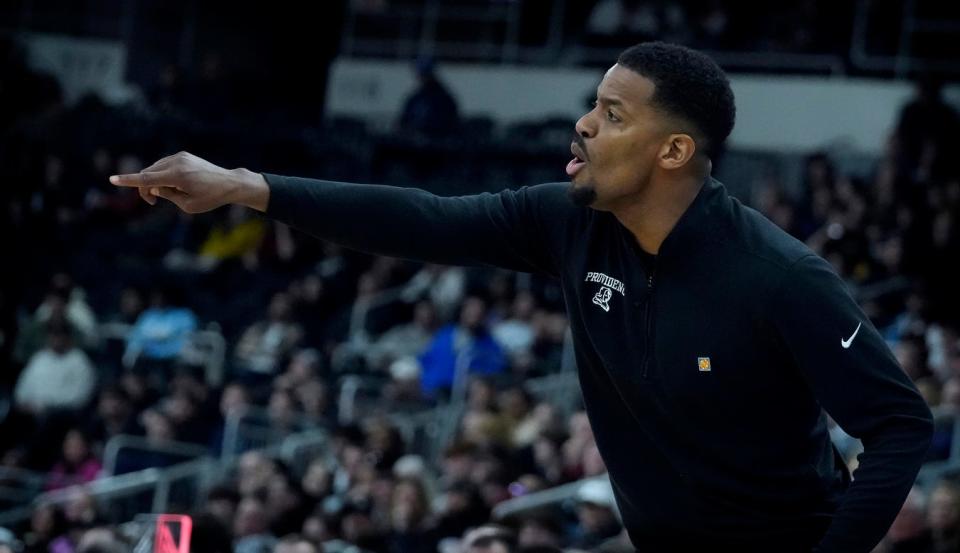 Providence College coach Kim English works from the sideline during the game against Boston College in Tuesday's NIT opening-round game.