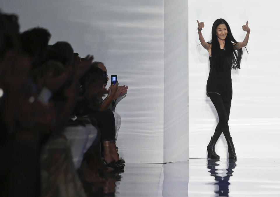 Fashion designer Vera Wang reacts to applause with thumbs up after showing her Spring 2014 collection on Tuesday, Sept. 10, 2013 in New York. (AP Photo/Bebeto Matthews)