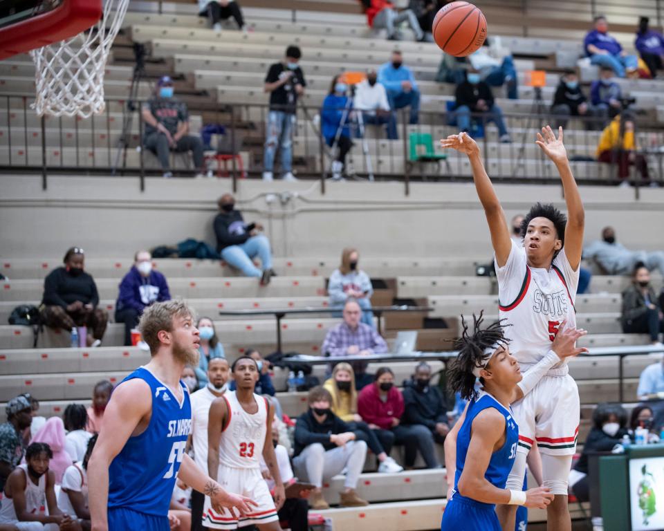 Highland Park Jahmir Kingcannon (5) shoots the ball Saturday.