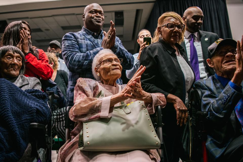 Survivors Lessie Benningfield Randle (left to right), Viola Fletcher, and Hughes Van Ellis sing together at the conclusion of a rally during commemorations of the 100th anniversary of the Tulsa Race Massacre on June 01, 2021 in Tulsa, Oklahoma. President Biden stopped in Tulsa to commemorate the centennial of the Tulsa Race Massacre. May 31st of this year marks the centennial of when a white mob started looting, burning and murdering in Tulsa's Greenwood neighborhood, then known as Black Wall Street, killing up to 300 people and displacing thousands more. Organizations and communities around Tulsa continue to honor and commemorate survivors and community residents.